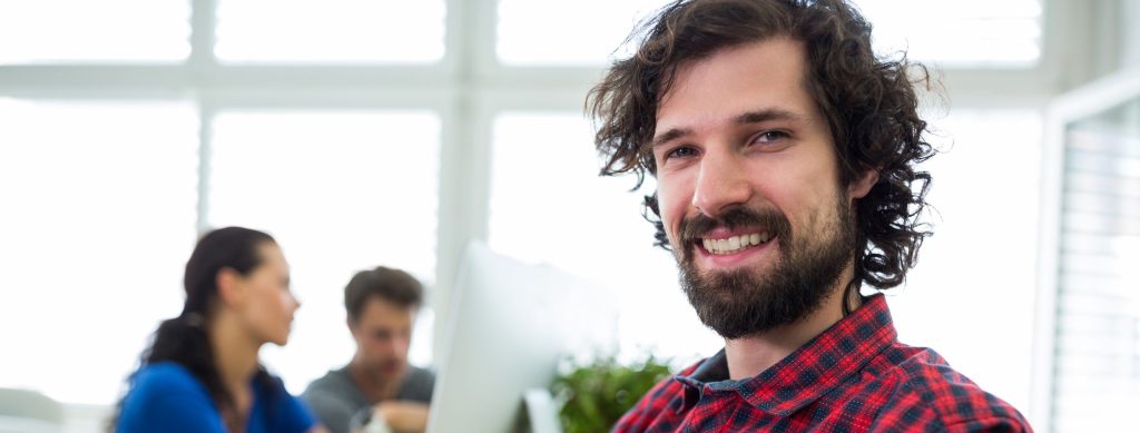 Portrait of male graphic designer with arms crossed